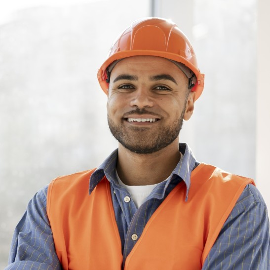 Photo of smiling construction worker on the site
